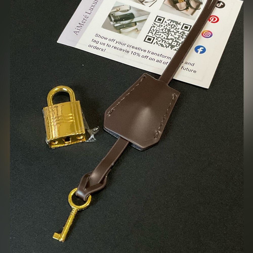Brown leather Clochette with gold lock and key